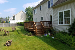 wood deck restoration and sealing project in Littleton Massachusetts backyard deck refinished by Finish Masters Builders