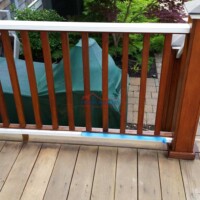 Enhance your outdoor space with professional deck staining and painting services. Beautiful wooden deck with fresh stain and protective finish.