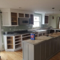 A spacious, updated kitchen featuring custom cabinetry, countertops, and modern appliances for a stylish look. Kitchen renovation with custom cabinets, countertops, and modern appliances.
