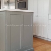 Expert kitchen cabinet painting and refinishing services by Finish Masters Construction & Painting. Refinished kitchen cabinets with a fresh, modern look for improved home aesthetics.