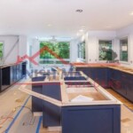 Interior kitchen remodeling with new cabinets and painting by Finish Masters. Modern kitchen renovation with custom cabinetry and painting.