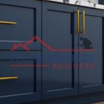 Up of stylish navy blue kitchen cabinets with gold handles, showcasing quality construction and painting. Modern navy blue kitchen cabinets with gold handles and black hardware.