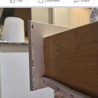 Up of a cabinet being professionally painted, showcasing quality craftsmanship and attention to detail. Properly painted cabinets by Finish Masters Construction & Painting.
