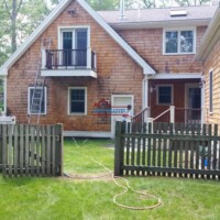 Exterior painting begins with a pressure cleaning to treat mold and mildew. skilled painters MA Southern NH prepping siding for exterior painting