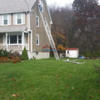 Professional house painting and exterior renovation by Finish Masters Construction & Painting. House painting and exterior renovation work in progress.