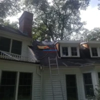 Chimney and roof repair by Finish Masters Construction & Painting. Expert exterior painting and roof.