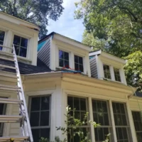 Exterior home painting and renovation project.