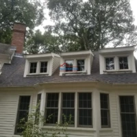 Roof and window renovation by Finish Masters Construction & Painting.