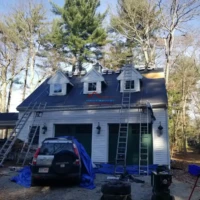 Roof replacement and repair work on a residential home with new roofing installation.