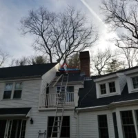Professional chimney repair service on a residential home.