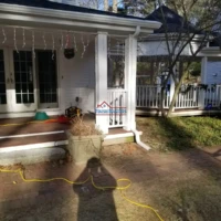 Back porch renovation with fresh paint and new decorations.
