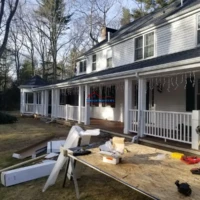 Construction and painting of a house porch.