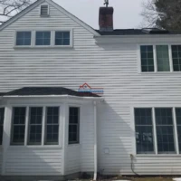 House exterior painting and renovation by Finish Masters Construction & Painting.