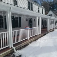 Exterior house painting and porch renovation in winter.