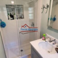 Modern bathroom with glass shower and sleek vanity. Bathroom shower with glass enclosure and modern fixtures.