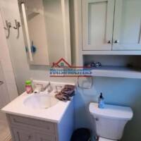 Professional bathroom vanity installation and plumbing repair in a residential bathroom. Finish Masters ensures quality and efficiency. Bathroom vanity installation and plumbing repair by Finish Masters.