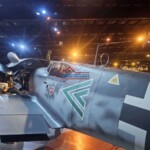 A vintage military aircraft being restored and painted with precision at Finish Masters, showcasing expert craftsmanship. Restoration and custom paint job on a vintage military aircraft at Finish Masters.