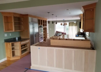 Kitchen cabinets being refinished in a home renovation project.