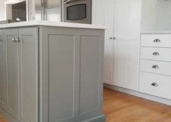 Kitchen cabinets being refinished in a professional home improvement project.