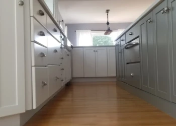 Kitchen cabinets being refinished with a fresh coat of paint in Nahant MA.