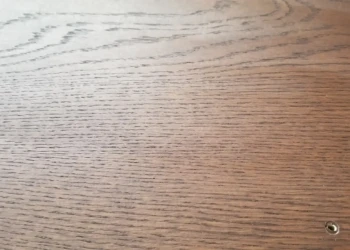 Close-up of sanded oak bathroom closet doors with open grain texture in Billerica MA cabinet refinishing project