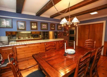 Traditional kitchen with stained wood cabinets and tiled countertop in Bedford NH dining area