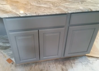 Gray refinished kitchen island cabinets with granite countertop in Carlisle kitchen