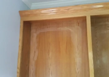 Refinishing wooden cabinets with a smooth, polished finish.