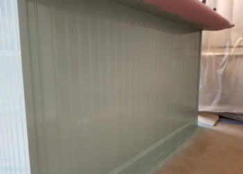 Close-up of a light gray decorative bead board panel with trim installed on a kitchen island in Merrimack, NH