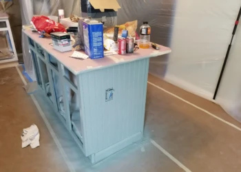 Kitchen island with beadboard paneling being refinished and painted as part of cabinet refinishing in Merrimack NH
