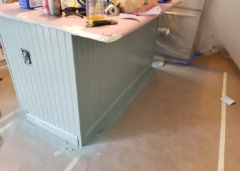 Painted kitchen island with decorative bead board and trim, part of a cabinet refinishing project in Merrimack NH