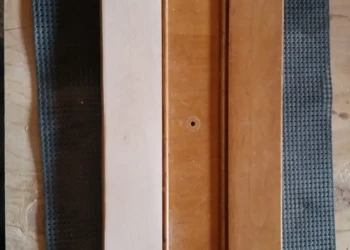 Cherry wood cabinet door showing partial sanding during cabinet refinishing process in Sudbury MA