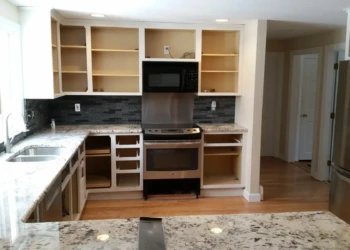 Kitchen with refinished cabinets removed for door and drawer refinishing in Sudbury MA kitchen remodeling