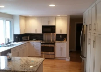 White kitchen cabinets refinished with modern hardware in a Sudbury MA kitchen