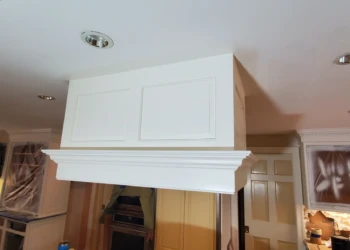 White refinish kitchen cabinets with gold hardware in Weston MA kitchen under renovation