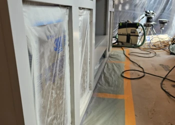 Close-up of cabinets undergoing primer application in a cabinet refinishing project in Windham NH