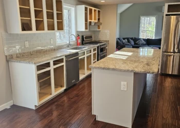 Refinished white kitchen cabinets in Windham NH without doors and drawers showing interiors