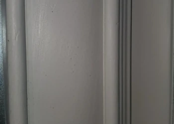 Close-up view of a cream-colored painted kitchen cabinet door frame showing its smooth finish in Windham, NH